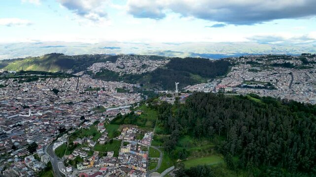 4k Ariel wide shot of Quito, Ecuador, and El Panecillo, Virgen de Legarda.