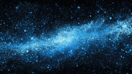 Abstract blue particles on a dark background create a dynamic effect