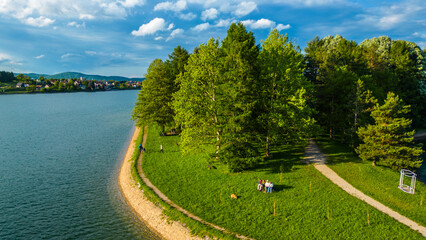 Scenic aerial view of lake (Jezero) Sabljaci near Ogulin, Croatia – a peaceful reservoir surrounded by forests and hills, perfect for outdoor activities and nature lovers