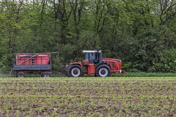 Professional agricultural machinery for processing plants and fields, transporting additional...