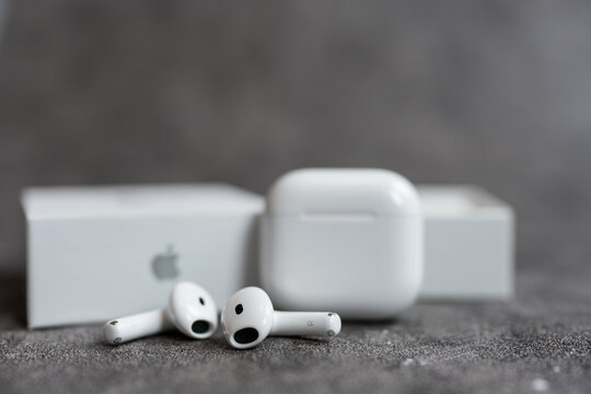 Bangkok, Thailand - May 19, 2025 : AirPods 4 generations on a gray background. Headphones from the apple company.