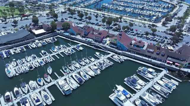 Aerial Long Beach city California marina overhead 1. Coastal city near Los Angeles. Cargo and container ship terminal. Cruise ship destination. Seaside resort boat marina and park.