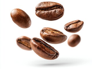 Obraz premium Coffee beans floating in air on white background studio shot close up detail of roasted brown coffee beans