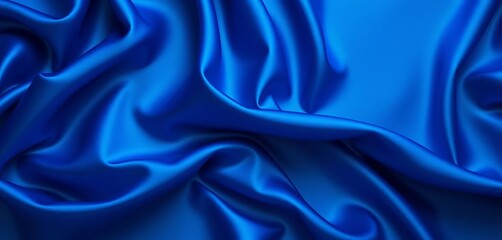 Fototapeta premium Deep blue silk fabric with elegant, flowing folds, creating a luxurious, wavy texture, folds, blue