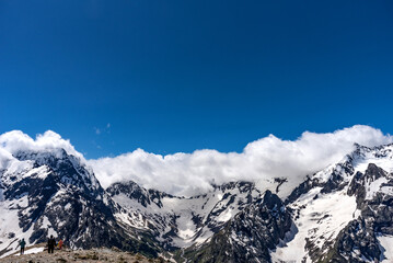 Picturesque summer landscape in Dombay with amazing snow-capped peaks of North Caucasus Mountains.
