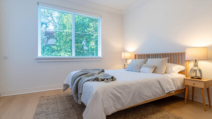 A warm and inviting minimalist bedroom featuring clean lines, neutral tones, and simple furniture. The design emphasizes comfort, functionality, and tranquility&mdash;ideal for concepts related to modern