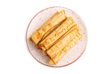 Waffles with caramel isolated on white, top view, close up