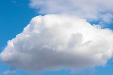 Against a blue sky in early May, large puffy clouds drift quietly over Pike Lake Unit, Kettle...