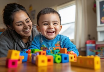 Happy toddler and mother playing with colorful blocks