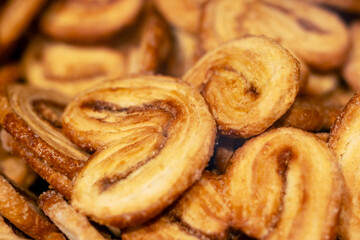 This is a close up image showcasing a delightful pile of heart shaped cookies
