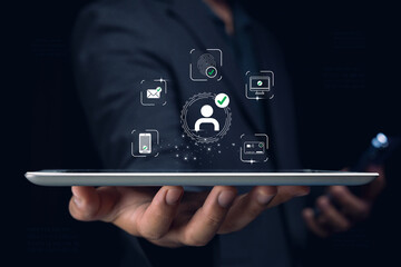 A man holds a tablet displaying digital security icons, representing identity verification and secure access technology.