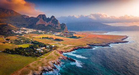 Panoramic evening view from flying drone of Sicily, Isolidda Beach, San Vito cape, Italy, Europe. Fantastic summer sunset on Mediterranean sea.Traveling concept background..