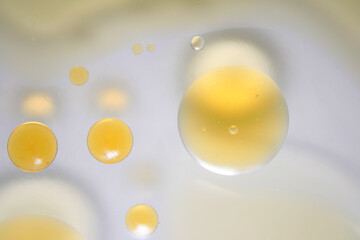 Abstract Close-Up of Bright Oil Droplets on Smooth Surface