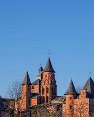 Obraz premium red stone turrets and bare trees in winter at collonges la rouge