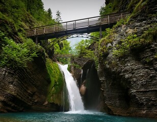 canyon waterfall with bridge