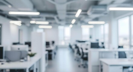Office Space: A soft focus view of a modern, minimalist office interior, with a clean design. Natural light pours through expansive windows, creating a bright and airy atmosphere.