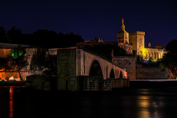 Pont Saint-Bénézet stretches across the Rhône in Avignon, France, leading the eye toward the...