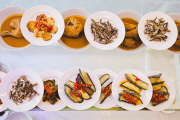 Traditional Indonesian Padang Food Variety Served in Small Plates