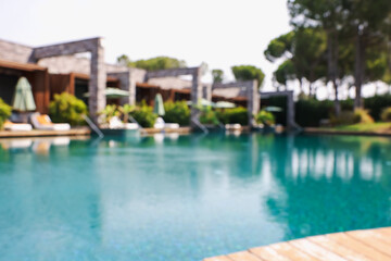Outdoor swimming pool at resort, blurred view