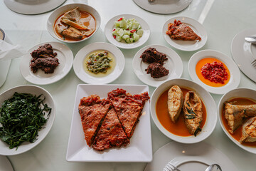 Assorted Minangkabau Dishes Served on a Traditional Table Setting