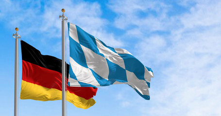 Bavarian flag waving with national german flag on a clear day