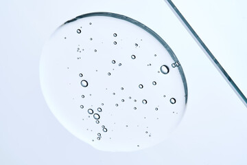 Cleansing micellar gel for face wash in a tube on a blue background.