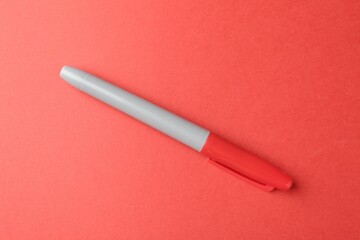 One color marker on red background, top view