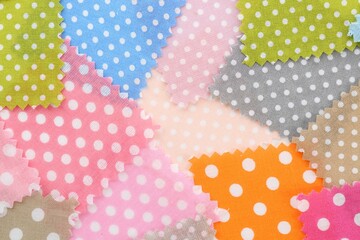 Samples of different fabrics as background, top view