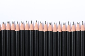 Sharp graphite pencils isolated on white, top view
