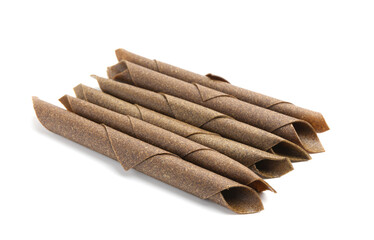 Delicious fruit leather rolls on white background