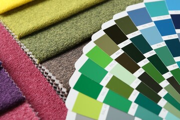 Samples of colorful fabrics and color palettes, closeup