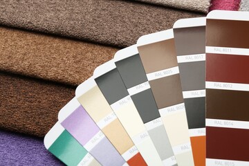 Samples of colorful fabrics and color palettes, above view