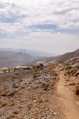 Most visited spot Jebel Jais scenic mountain landscape at Ras Al Khaimah, UAE. Breathtaking rocky peaks, winding roads, and popular tourist destination for hiking, camping, and zipline adventures