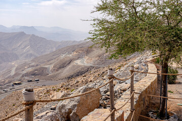 Most visited spot Jebel Jais scenic mountain landscape at Ras Al Khaimah, UAE. Breathtaking rocky peaks, winding roads, and popular tourist destination for hiking, camping, and zipline adventures