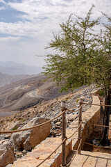 Most visited spot Jebel Jais scenic mountain landscape at Ras Al Khaimah, UAE. Breathtaking rocky peaks, winding roads, and popular tourist destination for hiking, camping, and zipline adventures