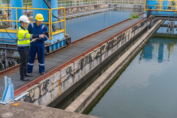 Environmental engineers work at wastewater treatment plants,Water supply engineering working at...