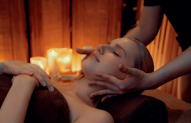 Caucasian woman enjoying relaxing anti-stress head massage and pampering facial beauty skin...
