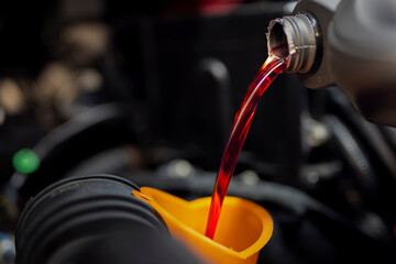 Checking dipstick for level oil in engine and gearbox car in garage. Engine service check, oil dipstick detail in service. Engine problems, engine repair at a car repair shop.Topping up oil