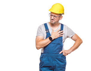 Middle aged construction worker having heart attack, craftsman has pain and holds hands on chest, isolated on white background. Studio shot