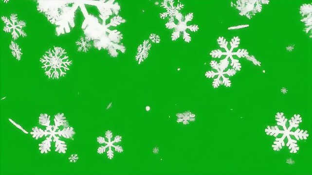 Realistic snowflakes falling in front of a solid green screen background for chroma key use.