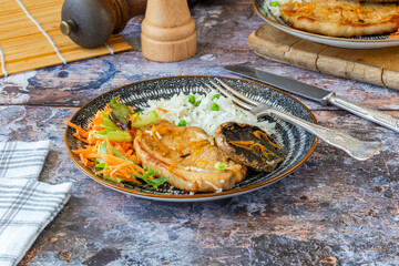 Orange glazed pork escalopes and portobello mushrooms with rice