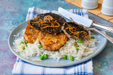 Orange glazed pork escalopes and portobello mushrooms with rice