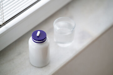 Tablet and glass of water