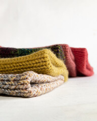 Colorful wool hats, on a white background.