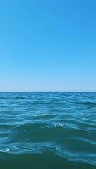 Fototapeta premium Tranquil ocean scene under a clear blue sky