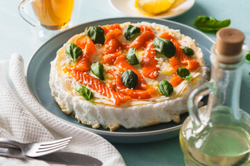 Omelette Poulard. Omelette of Mother Poulard. French omelette with whipped egg whites, lightly salted trout and basil. Beautiful, healthy and tasty breakfast.