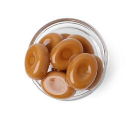 Tasty sweet caramel candies isolated on white, top view