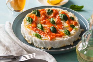 Omelette Poulard. Omelette of Mother Poulard. French omelette with whipped egg whites, lightly salted trout and basil. Beautiful, healthy and tasty breakfast.
