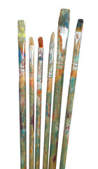 Brushes with different paints isolated on white