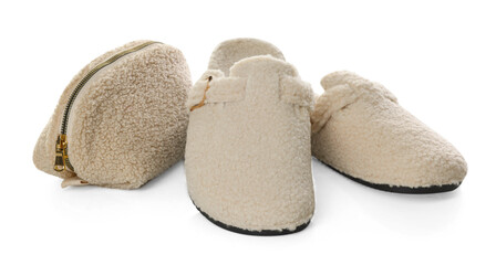 Stylish slippers and cosmetic bag isolated on white